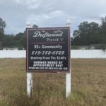 Installed Digitally Printed Driftwood Apartments Sign with Posts